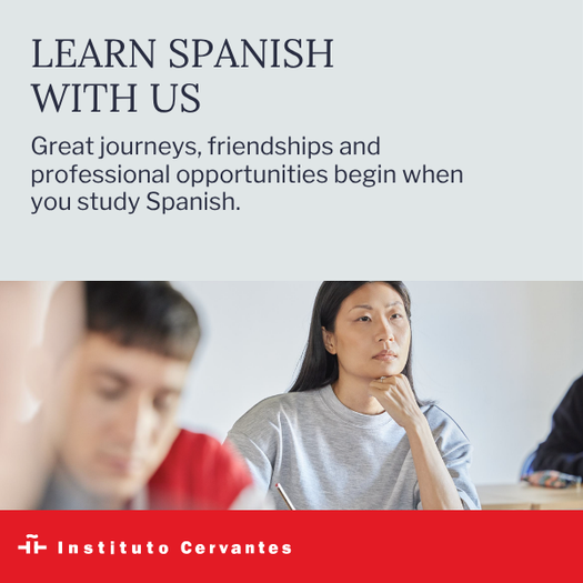 Promotional image of Spanish courses at the Instituto Cervantes, with the text ‘Learn Spanish with us’ and a photograph of people attending a class.